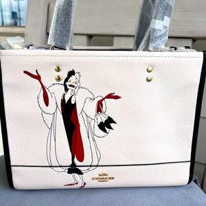 Limited Edition Disney Coach Villain Cruella bag with crossbody chain.